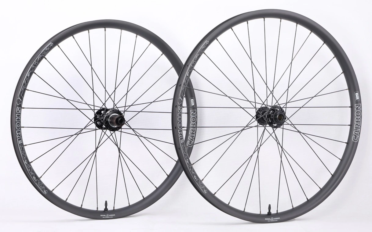Shore-Carbon carbon MTB wheelset with hand-built spokes and black hubs