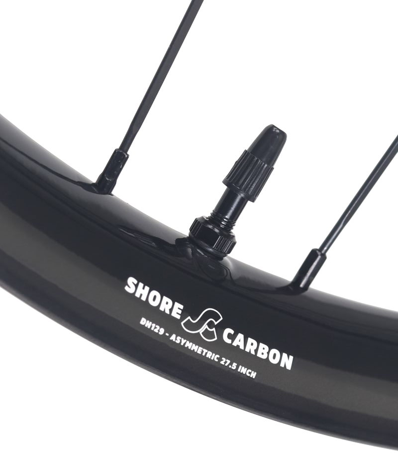 Close-up of Shore-Carbon asymmetric carbon MTB rim with tubeless valve